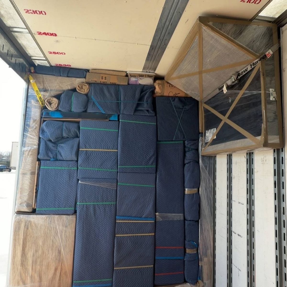 Padded furniture pack in Sutton Movers truck